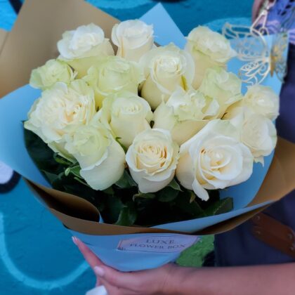 Elegant bouquet of White Mondial Roses with large, creamy white petals and a subtle ivory hue, arranged to exude timeless beauty and sophistication